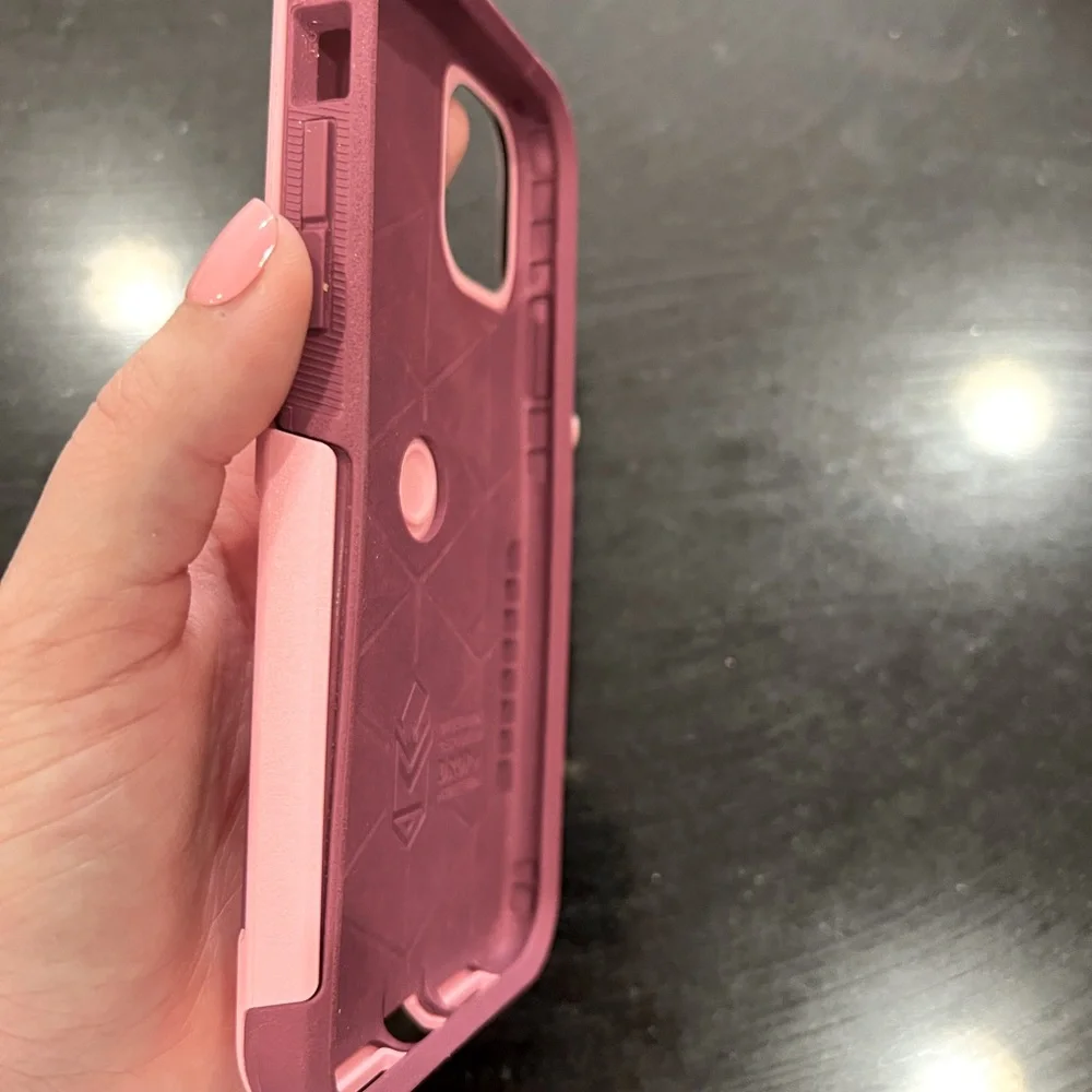 Pink/maroon otter box case. Can fit an iPhone XR. But it’s for iphone 11 .